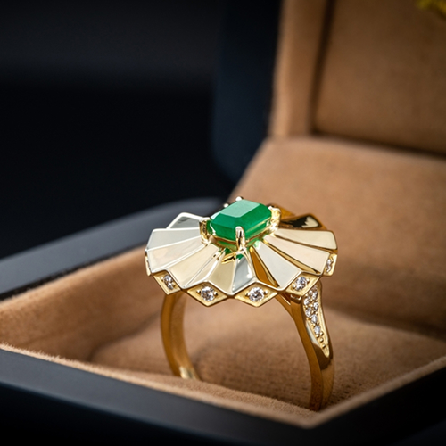 Macro shot of a unique geometric gold statement ring featuring an emerald-cut green gemstone and diamond accents resting in a brown jewelry box.